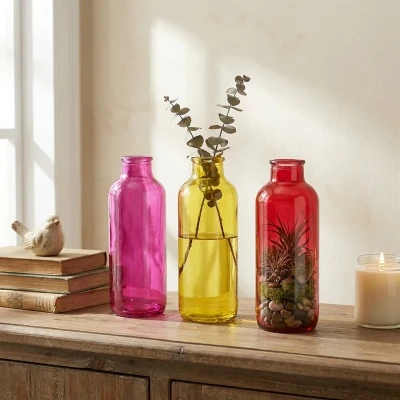 گلدان دکوری شیشه‌ای طرح کلاسیک ابعاد 7×7×19 سانتی‌متر و وزن 250 گرم، مناسب برای تراریوم و گیاهان طبیعی