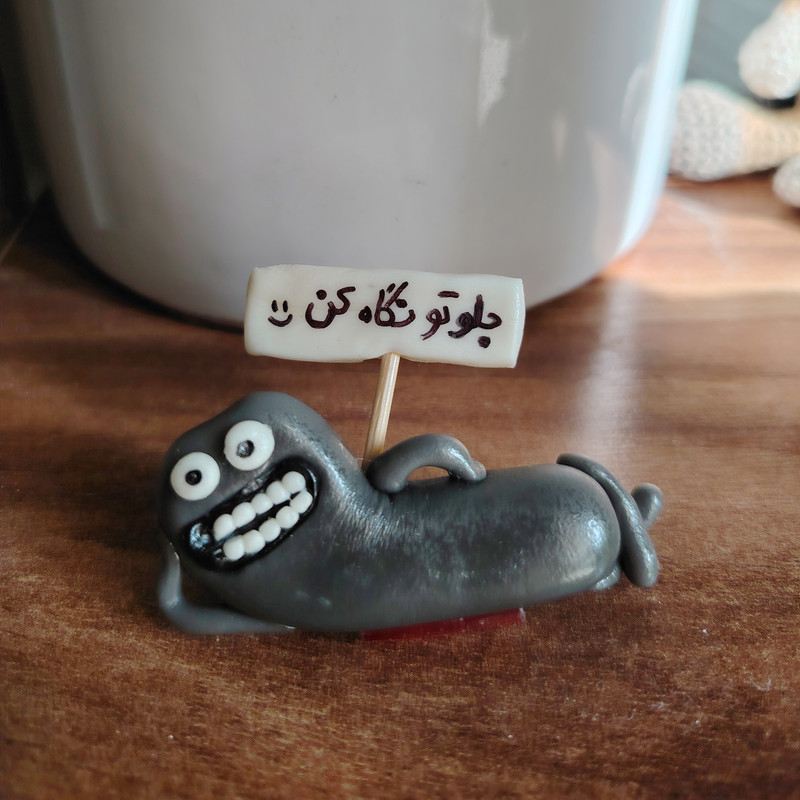 عروسک داشبورد خودرو طرح جلوتو نگاه کن