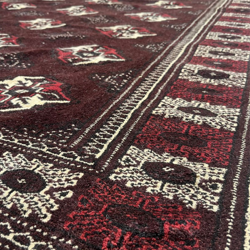 فرش دستبافت سه و نیم متری مدل بلوچ کد Nkpa.ha.f18 زمینه زرشکی