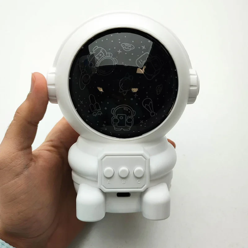 چراغ خواب رومیزی مدل فضانورد طرح رقص نور موزیکال