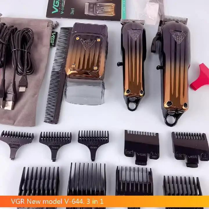مجموعه سه عددی ماشین اصلاح موی سر و صورت وی جی ار مدل V-644 با تیغه تیتانیوم و استیل ضد زنگ، قابلیت اصلاح صفر، خط زن و حجم زن، باتری لیتیومی با زمان استفاده تا 200 دقیقه، طراحی ارگونومیک و عملکرد خشک و مرطوب و نمایشگر وضعیت باتری