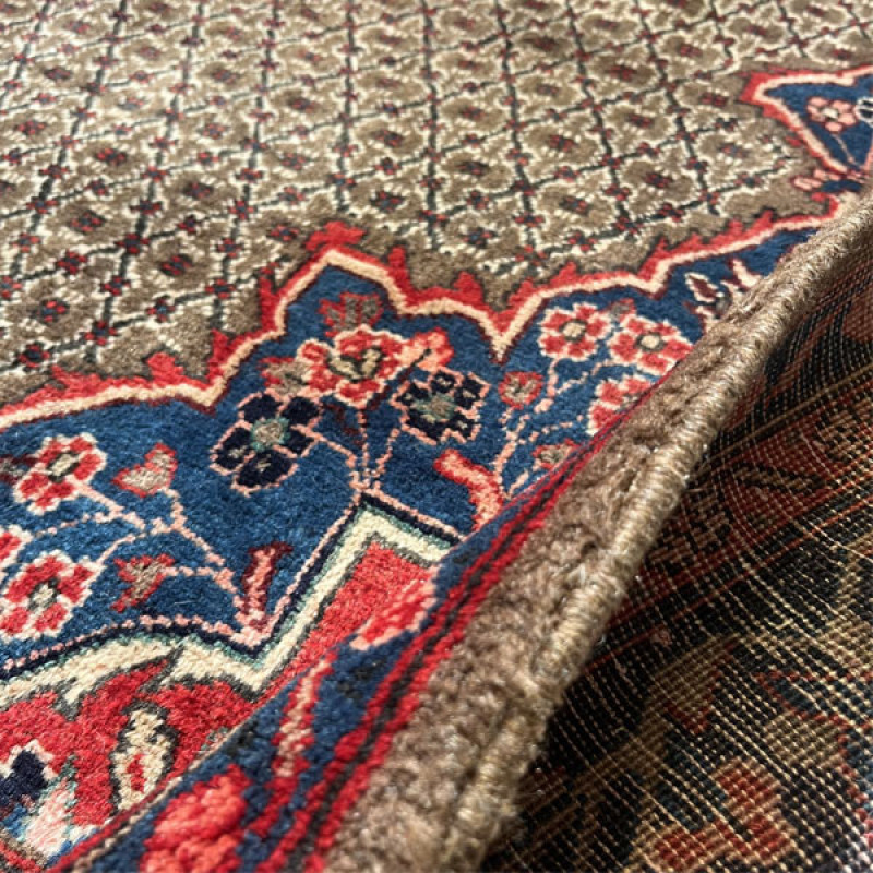 فرش دستبافت چهار و نیم متری مدل بلوچ کد Nkpa.ha.f21 زمینه قرمز
