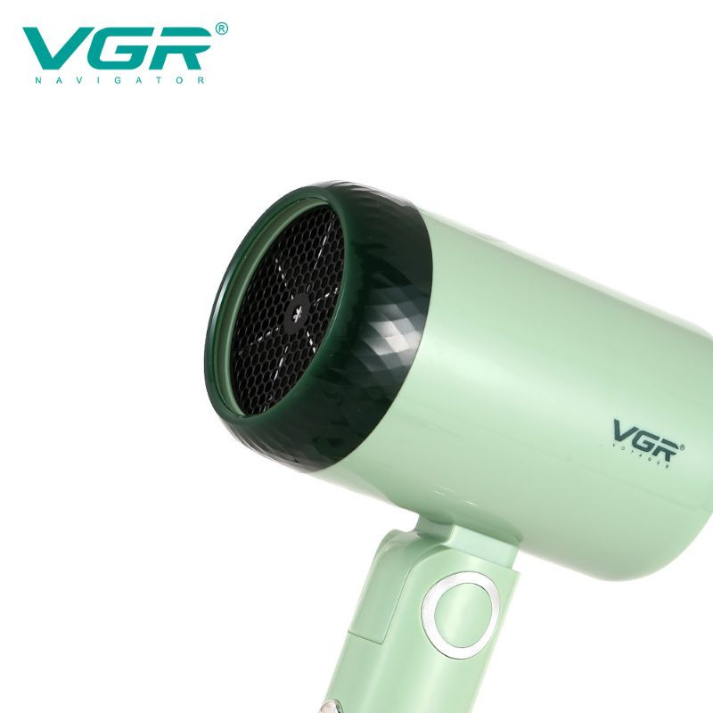 سشوار مسافرتی 1200 وات وی جی ار مدل 421، موتور DC، وزن 342 گرم، دارای سری متمرکز‌کننده باریک با ویژگی صاف‌کنندگی، با قابلیت باد سرد