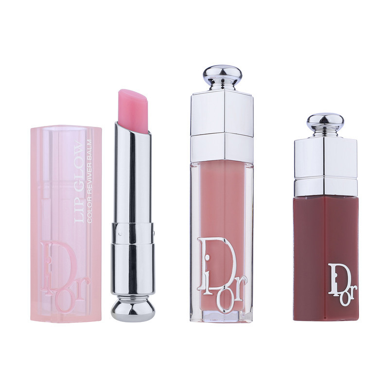 ست بالم و برق لب حجم‌دهنده دیور مدل Addict Trio Gloss آبرسان، دارای عصاره جوجوبا و مناسب پوست لب معمولی، بسته 3 عددی