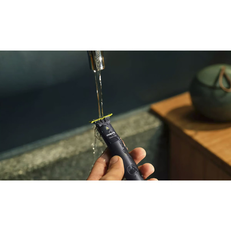 ماشین اصلاح موی صورت فیلیپس مدل QP1424.10 شارژی با تکنولوژی OneBlade، ضدآب، قابل استفاده خشک و مرطوب، تیغه استیل ضد زنگ، اصلاح صفر زن، دارای دو شانه 1 و 3 میلی‌متری، شارژ USB با 30 دقیقه استفاده مداوم