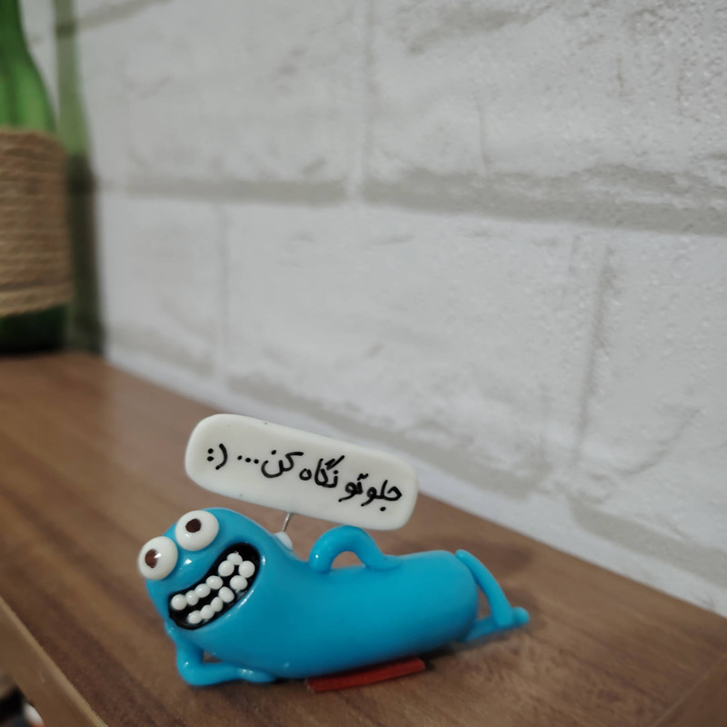 عروسک داشبورد خودرو طرح جلوتو نگاه کن