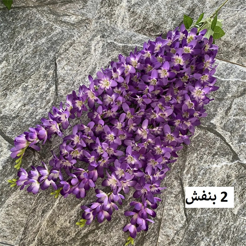 گل مصنوعی مدل آویز ارکیده با 5 شاخه گلدار، قابل تنظیم، قابل شستشو و انعطاف پذیر، مناسب فضای باز و گل‌های آپارتمانی با نصب دیواری، آویزی و ایستاده، ابعاد 85x23x5 سانتی‌متر و وزن 110 گرم