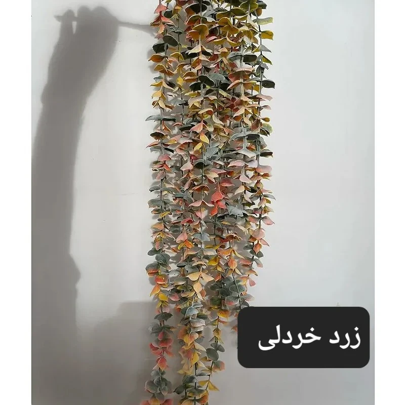 گل مصنوعی آویز شمشاد برفی مدل PAL.5550 از جنس پلاستیک، طول 75 سانتی‌متر، دارای 14 بازو، قابل شستشو و در دو رنگ سبز پودری و سبز دودی