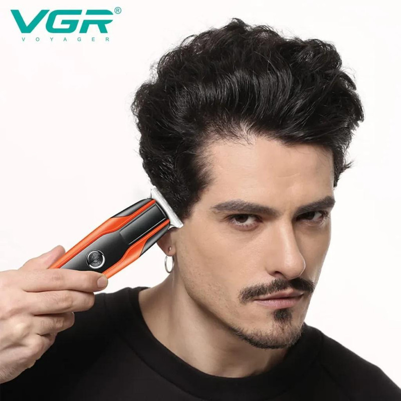 ماشین اصلاح موی سر و صورت وی جی آر مدل V-999 با تیغه استیل پیشرفته، اصلاح دقیق 0.01 میلی‌متر، استفاده خشک و مرطوب، باتری شارژی 90 دقیقه کارکرد و 4 شانه تنظیم طول