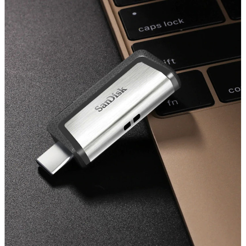 فلش‌مموری سن‌دیسک مدل Ultra Dual Drive USB Type-C ظرفیت 32 گیگابایت با دو درگاه USB3.1 و USB Type-C، سرعت انتقال تا 130 مگابایت بر ثانیه، قابلیت اتصال به گوشی و تبلت، طراحی جمع‌وجور و بدنه ترکیبی فلز و پلاستیک
