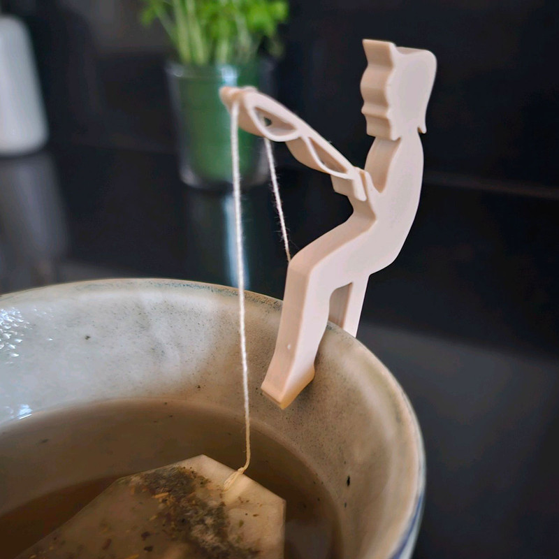 پایه نگه دارنده چای کیسه ای و دمنوش مدل پسر ماهیگیر مجموعه دو عددی