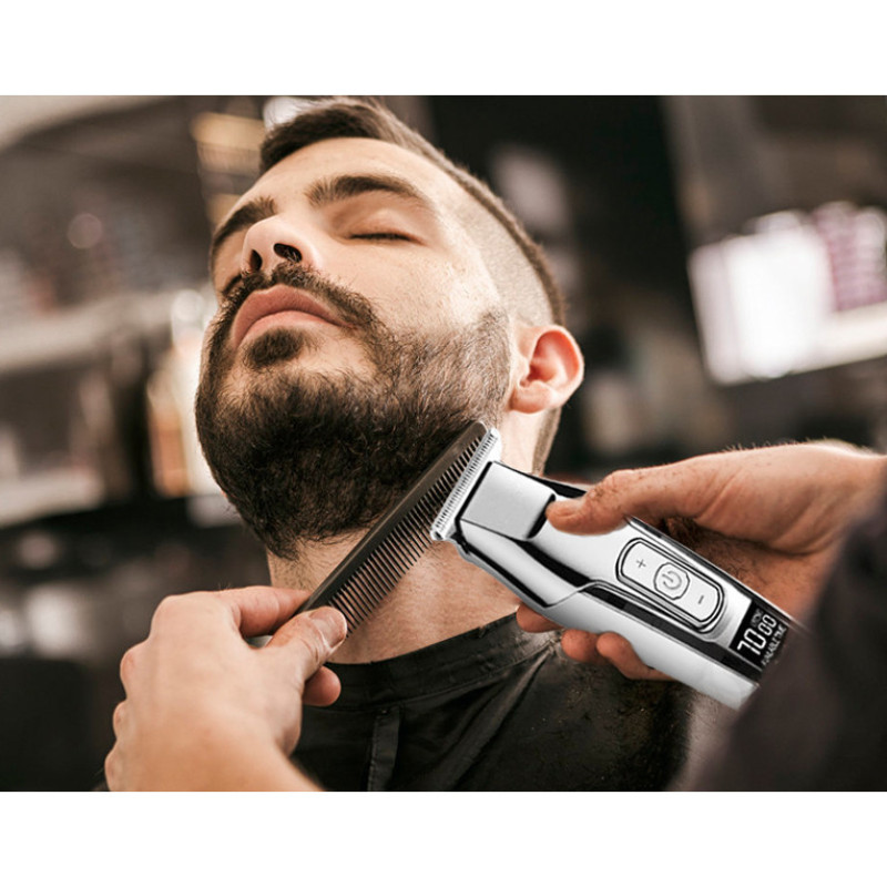 ماشین اصلاح موی صورت کیمی مدل KM-5027 با تیغه تیتانیوم پیشرفته، باتری قابل شارژ با 240 دقیقه مدت استفاده، قابلیت اصلاح خشک و مرطوب، تنظیم طول اصلاح از 0.1 تا 3 میلی‌متر و طراحی ارگونومیک کم‌صدا