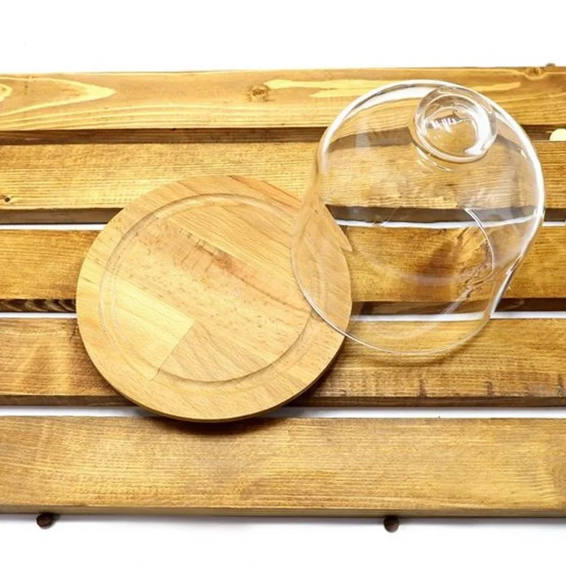 ظرف سرو پنیر پایه چوبی با درپوش شیشه‌ای شفاف، ابعاد 17.5×17.5×16، وزن 500 گرم، مناسب شستشو با دست، فرم دایره‌ای